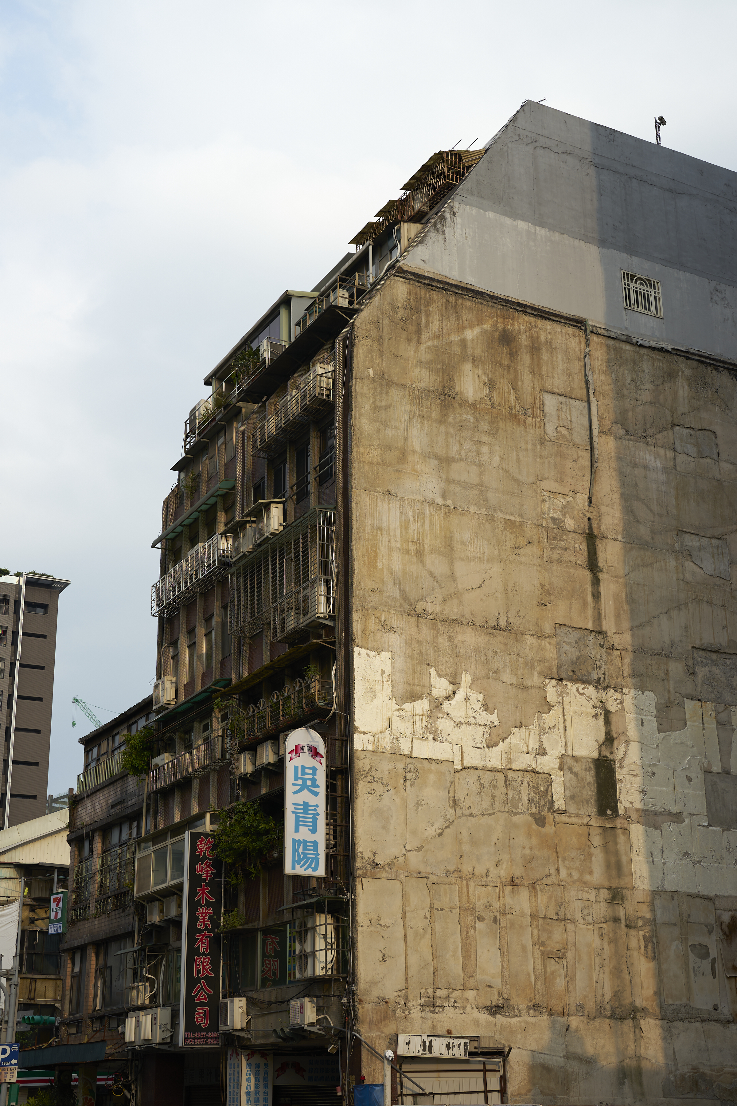 sunshine on exposed apartment block wall