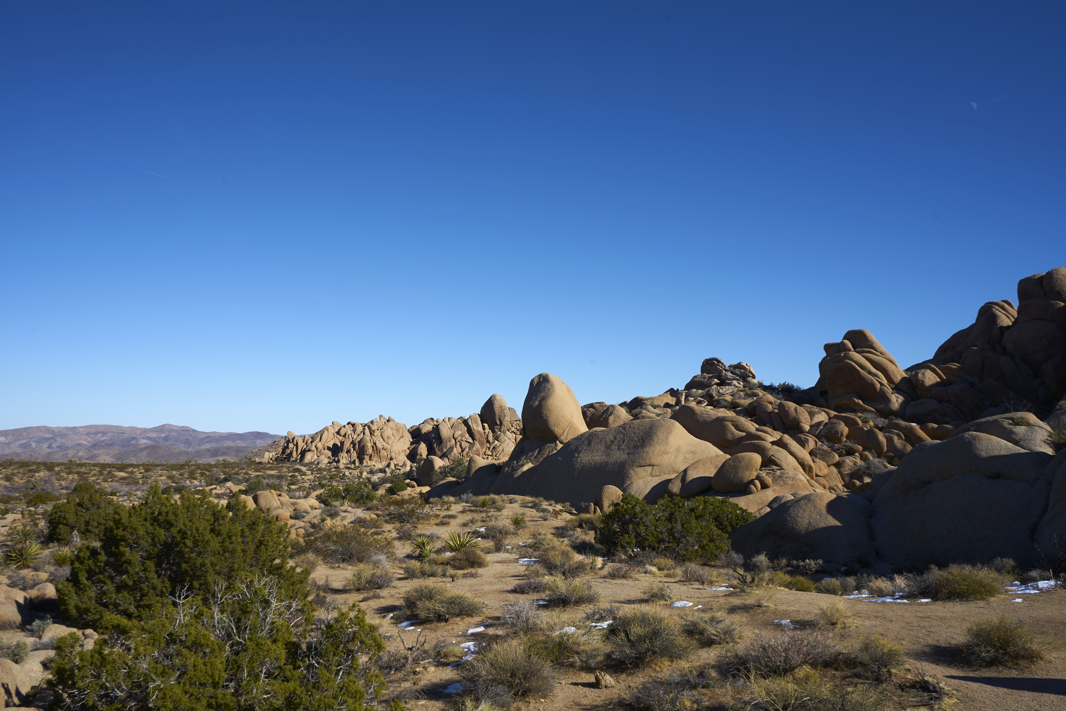 crumbling landscape and blue sky in joshua tree national park