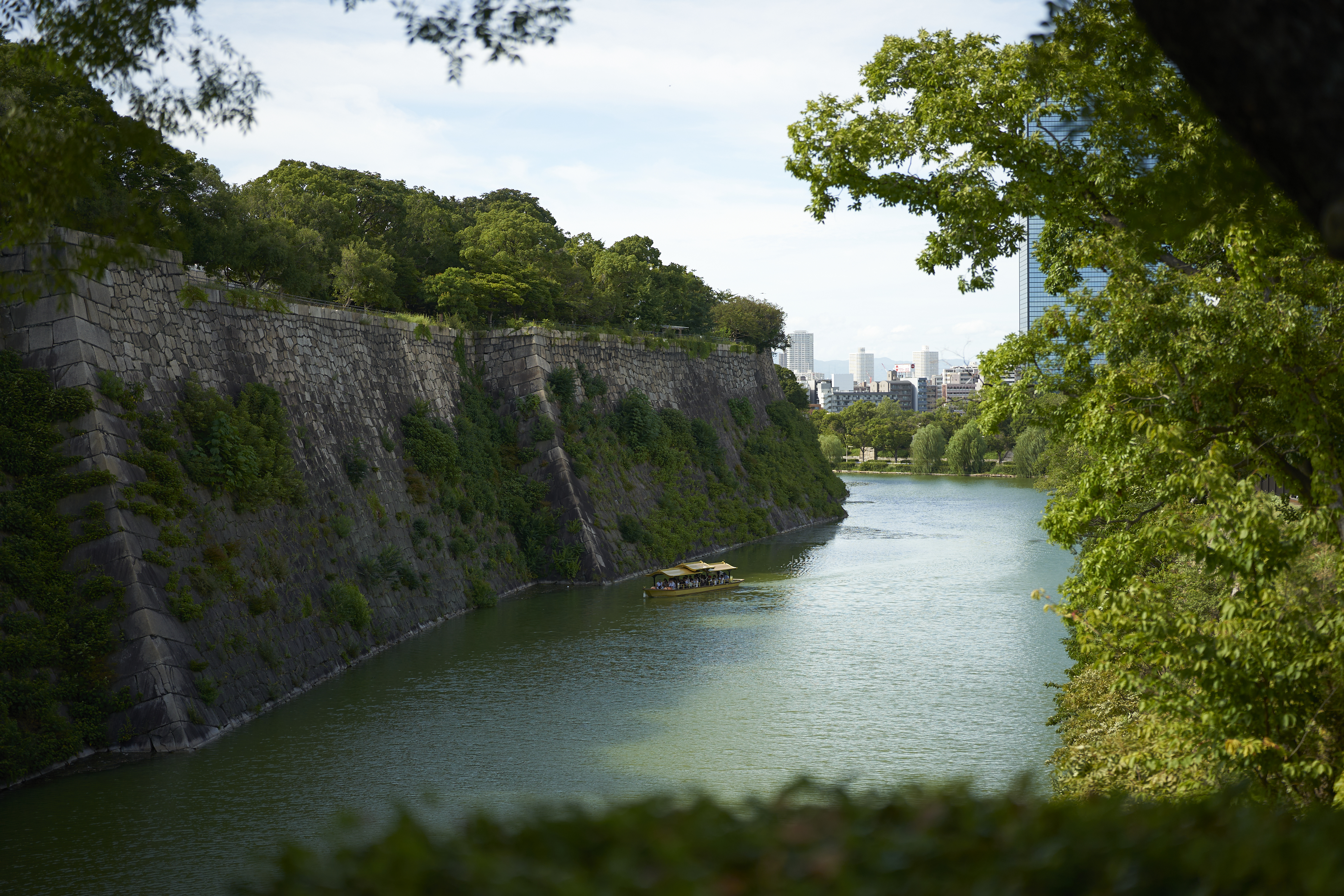 osaka castle walls over golden boat